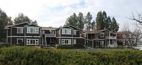 a row of houses on the side of a street